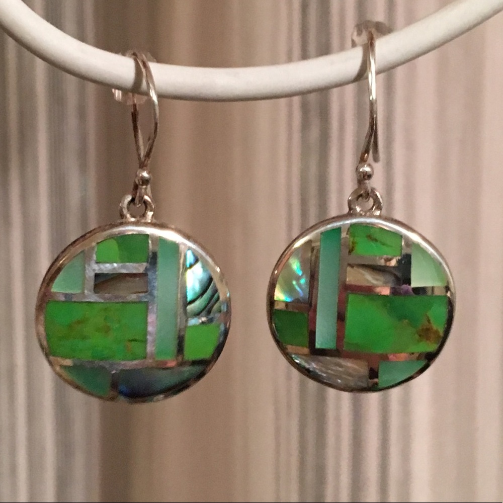Sterling silver dangle green earrings.